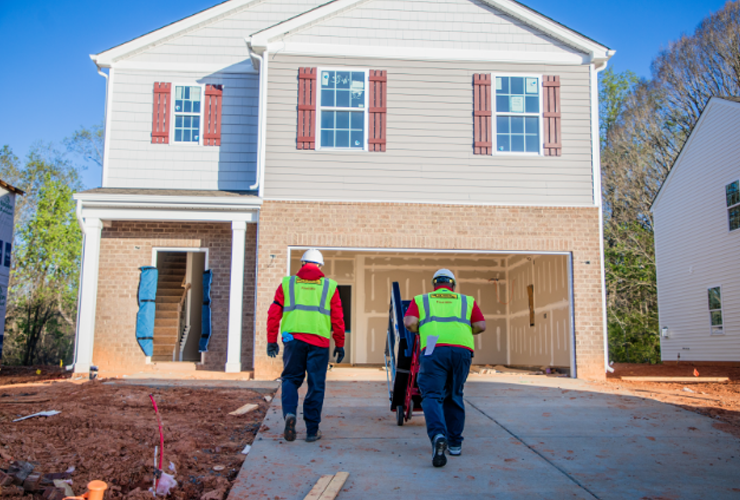 final mile employees loading an oven into a house