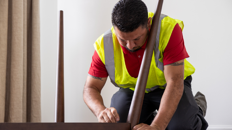 final mile employee assembling furniture