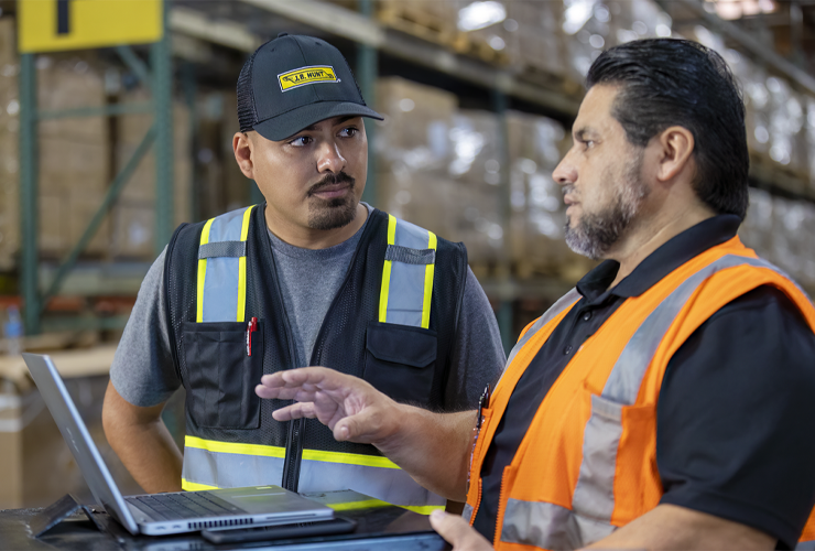 Two J.b. Hunt employees in a warehouse