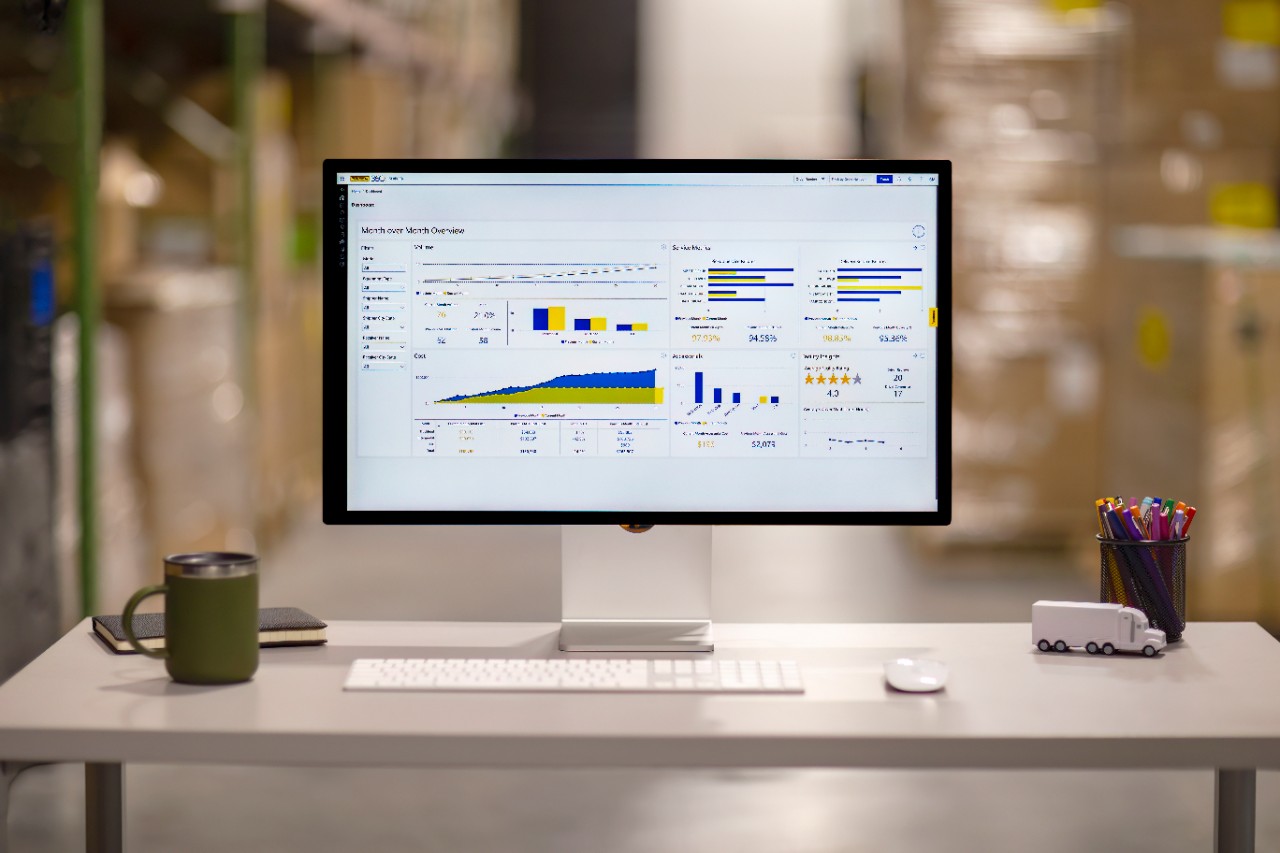 Computer monitor with shipper 360 on the screen on a desk in a warehouse space